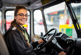 Fototapeta Londyn - A female truck driver smiling at the camera