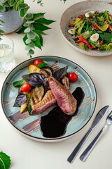 Wall Mural - grilled marbled beef steak on a plate with grilled vegetables an