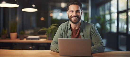 Happy freelancer man enjoying remote work and self employment smiling at camera