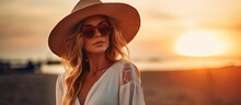 Stylish Woman On The Sandy Beach At Sunset Relaxing And Enjoying Her Vacation With Plenty Of Space