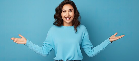 Poster - A happy young woman with open hands is pointing and smiling suggesting an advertisement