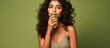 © HN Works - Indian woman drinking soda on beige background with copy space