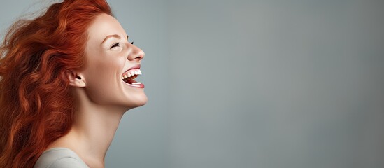 Wall Mural - Excited red haired woman screaming and reaching towards empty space
