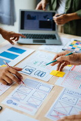 Wall Mural - ux developer and ui designer brainstorming about mobile app interface wireframe design with customer