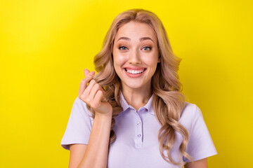 Sticker - Portrait of cheerful woman with wavy hair dressed purple t-shirt fingers showing k-heart symbol isolated on yellow color background