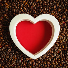 Creative Layout Made Of White Heart Shaped Frame And Coffee Beans Against Vibrant Red Background. Flat Lay, Copy Space. Love Concept. Valentine's Design.