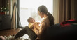 © Gorodenkoff - Mother and Baby Bonding Moment: Authentic Shot of an Asian Woman New to Motherhood Playing with her Cute Child in the Morning at Home. Cozy and Warm Atmosphere for a Mother and her Playful Infant