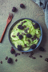 Wall Mural - Cucumber salad with blackberries and yogurt dressing