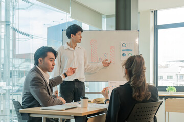 Wall Mural - Business team Asian discussing investment project working and planning strategy. Business people talking together with laptop computer at office