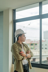 Wall Mural - Portrait Asian engineer man working with walkie talkie at construction site