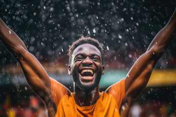 Portrait of champion athlete on stadium , emotions of a winner, joy, delight, emotional, rain, splash drops