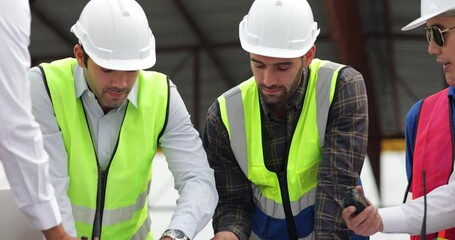 Wall Mural - Slow motion video Success teamwork. Ethnic diversity worker people. Group professional Construction engineering people in hardhat safety helmet meeting at Prefabricated concrete walls Industry Factory