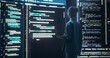 © Gorodenkoff - Shot of Female Programmer Working in a Monitoring Control Room, Surrounded by Big Screens Displaying Lines of Programming Language Code. Portrait of Woman Creating a Software, Coding