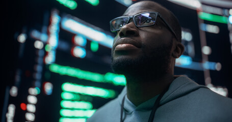 Poster - Close-Up Portrait of Young Black Man Looking at Big Digital Screens Glitching While Displaying Code. Worried Professional Programmer Fixing a Bug, Dealing with Crashing System, Thinking of Solutions.
