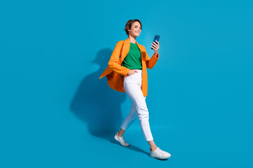 Poster - Full body size cadre of young optimistic project manager nice woman student communicating phone chat isolated on blue color background