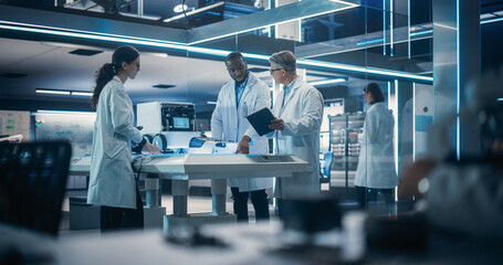 Fototapete - Diverse Team of Industrial Robotics Specialists Gathered Around a Table With a Mobile Robot. Engineers In Lab Coats Discussing an Automated Robotic Delivery Assistant with Artificial Intelligence