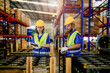 © ultramansk - checking and inspecting metal machine part items for shipping. male and woman worker checking the store factory. industry factory warehouse. The warehouse of spare part for machinery and vehicles.