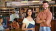 © Monkey Business - Portrait Of Female Manager With Digital Tablet And Waiter Working In Restaurant Or Coffee Shop