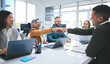 © Azee Jacobs/peopleimages.com - Creative people, handshake and meeting in hiring, partnership or deal agreement together at the office. Group of employees shaking hands in recruiting, company growth or startup at the workplace