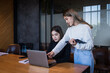 © EduLife Photos - Two female students study together in the library, learning and preparing for university exam