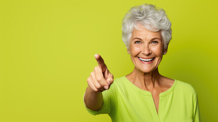 Senior woman wearing casual clothes pointing with hand and finger to the side looking at the camera.