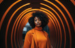 Young African American woman standing in the middle of an orange tunnel. Generative AI.