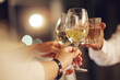 © Charlize Davids/peopleimages.com - Celebration, people hands and toast alcohol drinks for achievement, congratulations party or luxury gala vent. Support, night friends and group cheers with champagne, sparkling wine or glass beverage