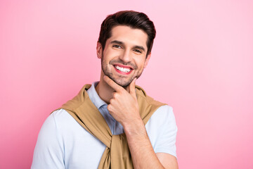 Wall Mural - Photo of cheerful creative person beaming smile arm touch chin empty space ad isolated on pink color background