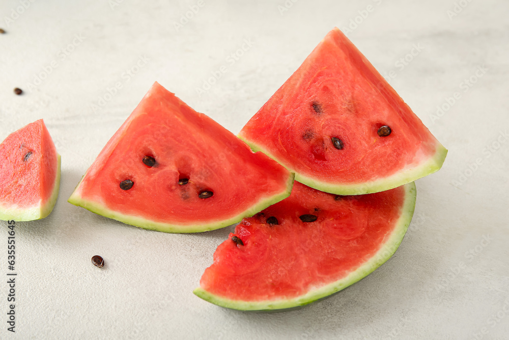 Pieces of ripe fresh watermelon on light background, closeup