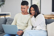 © Azee Jacobs/peopleimages.com - Relax, laptop and couple on a sofa in the living room doing online shopping together at home. Happy, love and young man and woman browsing on social media or the internet with computer at their house
