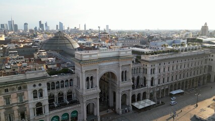 Wall Mural - Europe, Italy, Milan - Aerial view of Piazza Duomo, gothic Cathedral in downtown center city. Drone aerial view of Vittorio Emanuele gallery and new skyline  - Duomo Unesco Heritage sightseeing 