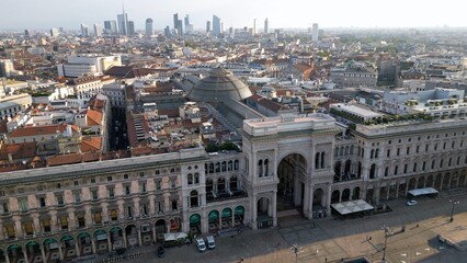 Wall Mural - Europe, Italy, Milan - Aerial view of Piazza Duomo, gothic Cathedral in downtown center city. Drone aerial view of Vittorio Emanuele gallery and new skyline  - Duomo Unesco Heritage sightseeing 