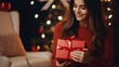 © pvl0707 - Closeup shot of a woman holds a Christmas gift box with a red ribbon in her hands. Holidays concept. created with Generative AI technology