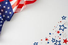 Developing The Notion Of A Cheerful Labor Day Festivity. Top View Composition Of American National Flag, Patriotic Confetti On White Background With Empty Space For Advert Or Text