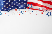 Picturing A Vibrant Concept For A Happy Labor Day Celebration. Top View Photo Of USA National Flag, Star-shaped Confetti On White Background With Empty Space For Advert Or Text