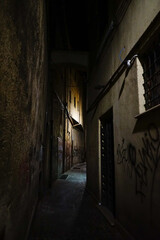 Wall Mural - Gloomy narrow street at the night in Terni, Umbria, Italy