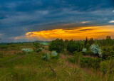 Fototapeta Na sufit - lowland landscape with sundown