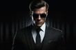 A secret agent in a suit and dark sunglasses.
