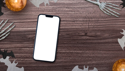 Wall Mural - table top view with a smartphone with transparent screen png and halloween objects