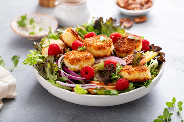 Wall Mural - Fried goat cheese salad with apples and raspberries and vinaigrette dressing
