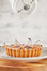 Canvas Print - French Flair, cherry clafoutis presented on white marble dusted with powdered sugar