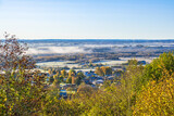Fototapeta Miasto - Landscape view with mist and autumn colors
