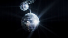 A Colorful Disco Mirror Ball Illuminates The Backdrop Of A Nightclub. The Party Lights Up The Disco Ball.