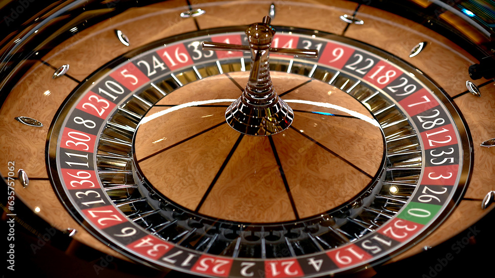 Roulette table in a casino, with many games and slots, roulette wheel in the foreground. Golden and luxurious light, casino interior. Gambling is betting on money or gambling for money.
