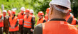 © Yevhen - Helmet builder. Many construction workers helmet. Team in hardhat for work. Worker group wearing vest, safety. Building concept. Engineers on constructing site. Builder man