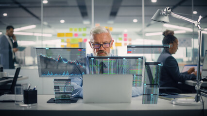 Poster - Confident Senior Venture Capital Director Using Laptop Computer in Office with Colleagues. Experienced Trader Searches Market Opportunities. VFX Hologram Edit Visualizing Stock Exchange Interface.