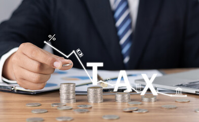 Tax and Vat concept. Government, state taxes concept. Businesman hand and pile of coins on the table. complete Individual income tax return form online for tax payment. Data analysis.