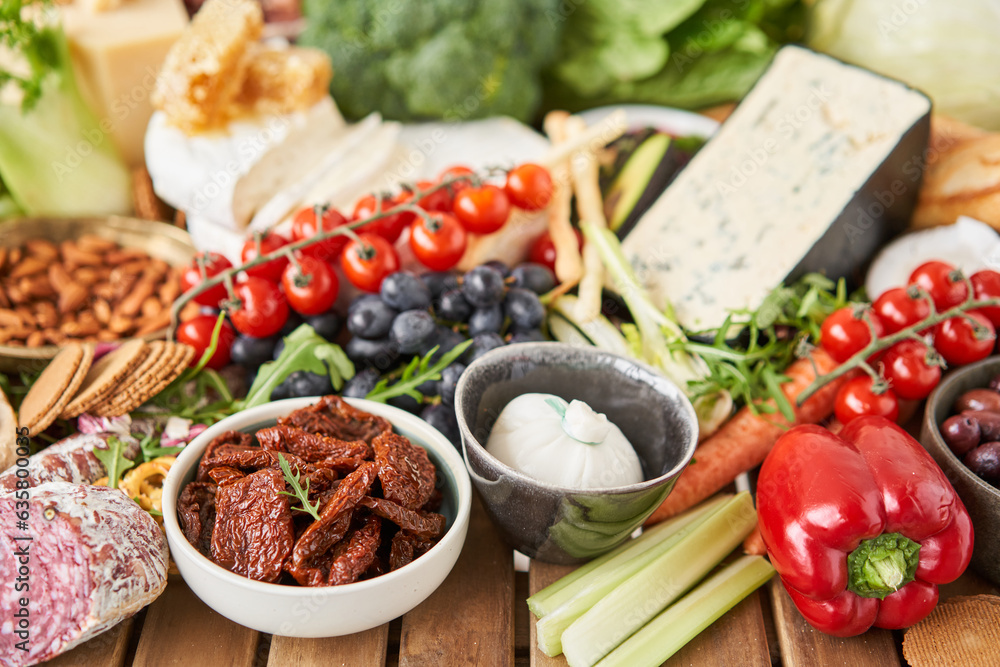 Dried tomatoes. Table full of mediterranean appetizers, tapas or ...