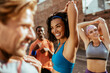 © Marko Geber - Diverse young group of people getting ready to jog and exercise together in the city
