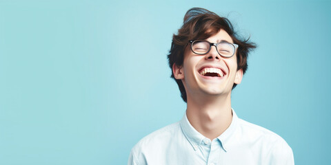 Wall Mural - Happy young man on a solid background